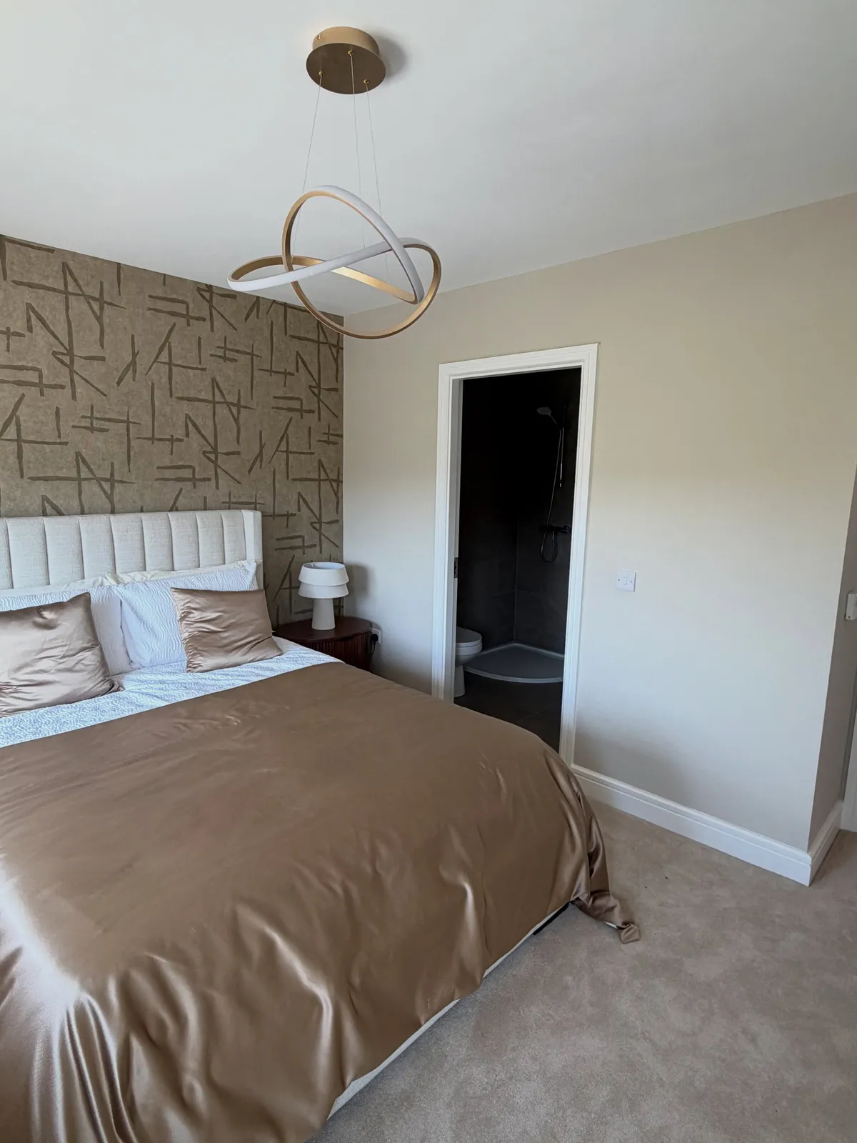 Bedroom with a statement feature wall decorated in Cork